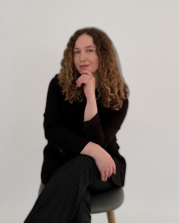 Alexandra Moldovan, seated, wearing black.